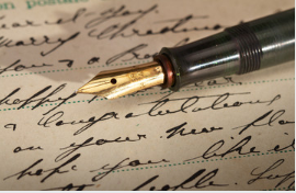 Old pen nib and cursive handwriting 