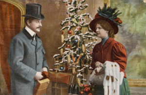 Man and Woman by a Christmas tree