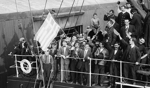 Men on a passenger ship waving a flag
