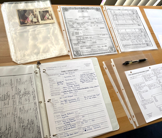 A bunch of family history documents in folders and files.